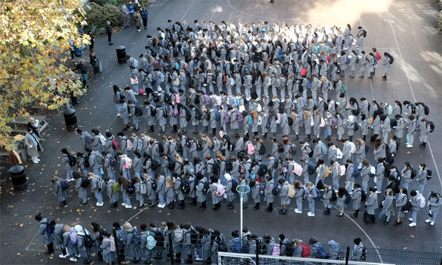 A large group of people marchingDescription automatically generated with low confidence